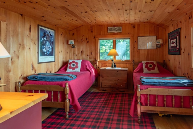 228 Starbird Ln, Rome, ME 04963 - bedroom featuring lofted ceiling, wood walls, and wood ceiling