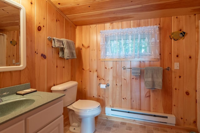 228 Starbird Ln, Rome, ME 04963 - bathroom with a baseboard radiator, toilet, wood walls, and vanity