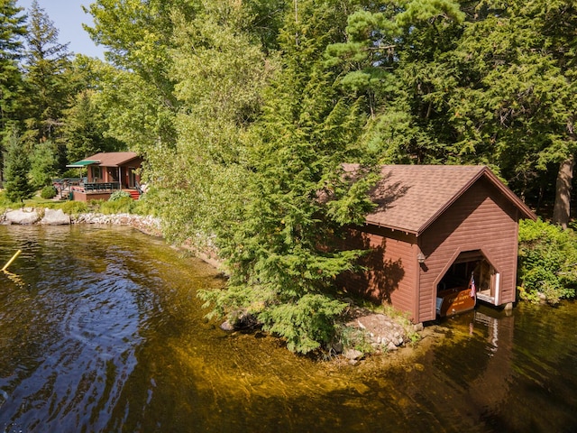 228 Starbird Ln, Rome, ME 04963 - view of subject property featuring a large body of water and a heavily wooded area