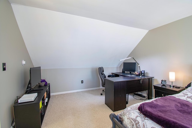 carpeted bedroom featuring vaulted ceiling and baseboards