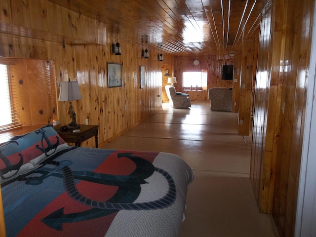 bedroom featuring wood walls