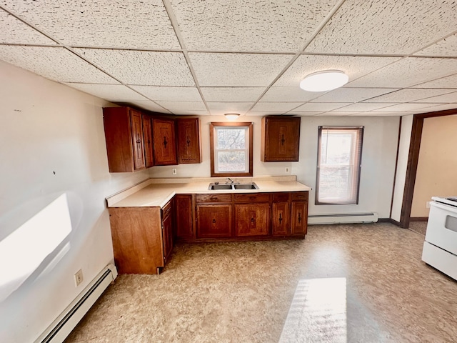 114 Skowhegan Rd, Fairfield, ME 04937 - kitchen with baseboard heating, a sink, electric range, a drop ceiling, and light countertops