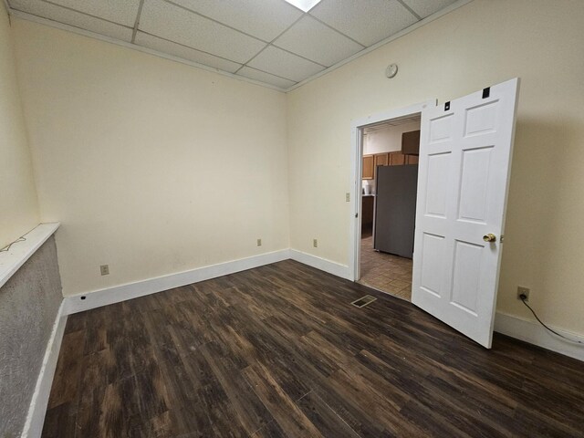 55 Cony St, Augusta, ME 04330 - spare room featuring a paneled ceiling, dark wood-style floors, and baseboards