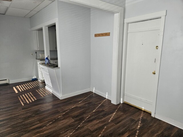 55 Cony St, Augusta, ME 04330 - entryway featuring dark wood-style flooring, baseboards, and a drop ceiling