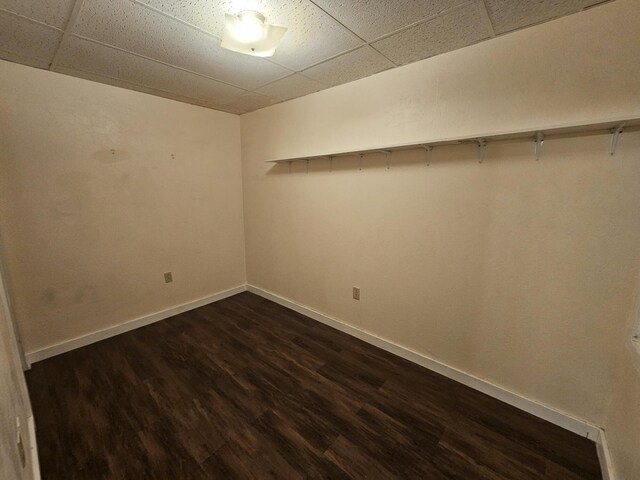 55 Cony St, Augusta, ME 04330 - unfurnished room featuring a drop ceiling, dark wood-type flooring, and baseboards