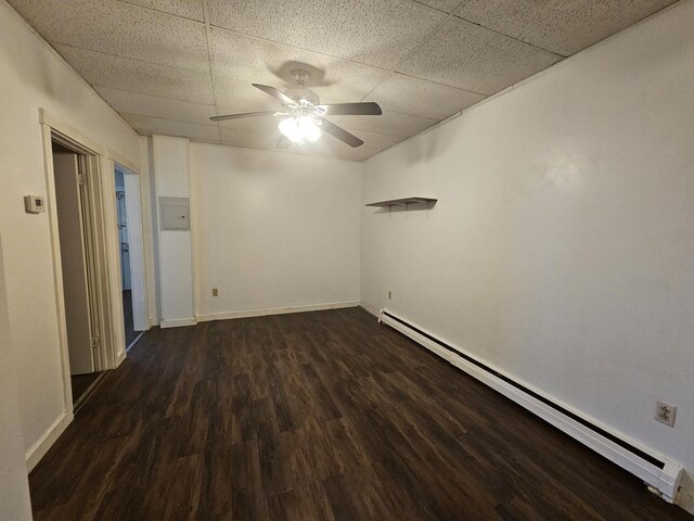55 Cony St, Augusta, ME 04330 - unfurnished room featuring a baseboard heating unit, dark wood-style floors, ceiling fan, a drop ceiling, and baseboards