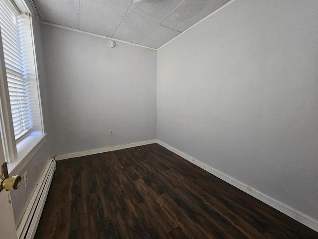 55 Cony St, Augusta, ME 04330 - spare room featuring a baseboard radiator, dark wood finished floors, baseboards, and a paneled ceiling