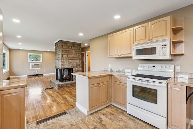 7 Alweber Rd, Windham, ME 04062 - kitchen with white appliances, light brown cabinetry, a peninsula, light countertops, and open floor plan