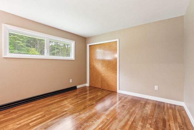 7 Alweber Rd, Windham, ME 04062 - unfurnished bedroom with light wood-style flooring, baseboards, and a closet