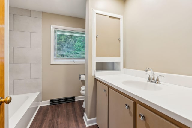 7 Alweber Rd, Windham, ME 04062 - bathroom with vanity, wood finished floors, toilet, and baseboards