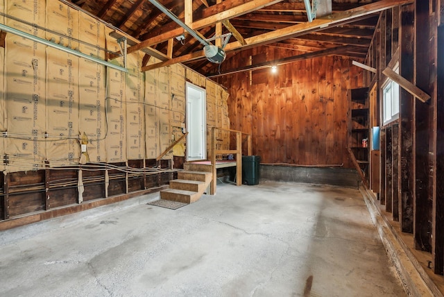 7 Alweber Rd, Windham, ME 04062 - garage featuring a garage door opener and wood walls
