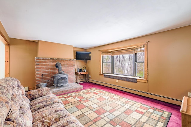 unfurnished living room featuring a wood stove, carpet floors, and baseboard heating