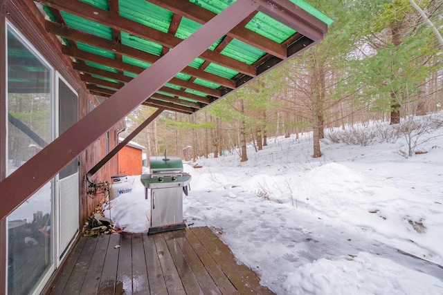 snow covered deck featuring area for grilling