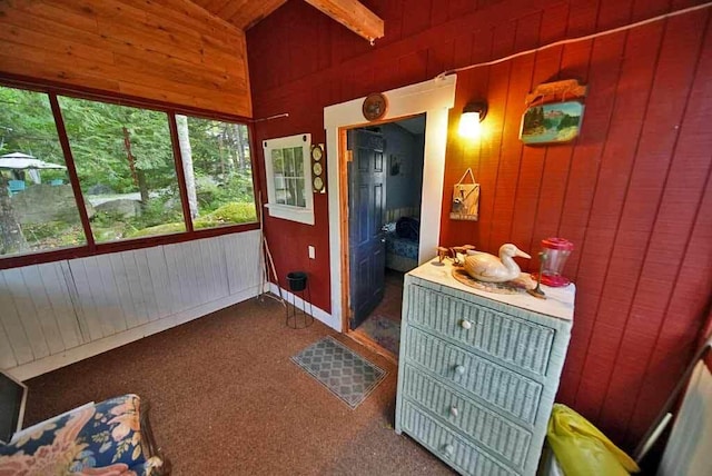 sunroom / solarium featuring vaulted ceiling