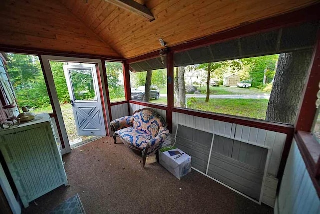 unfurnished sunroom with vaulted ceiling and wooden ceiling