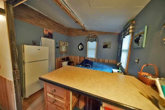 kitchen with light wood-type flooring and white refrigerator