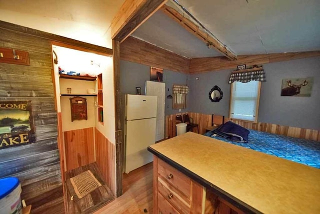 kitchen featuring white fridge and wood-type flooring