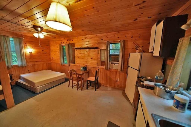 dining area with plenty of natural light, wooden ceiling, and ceiling fan