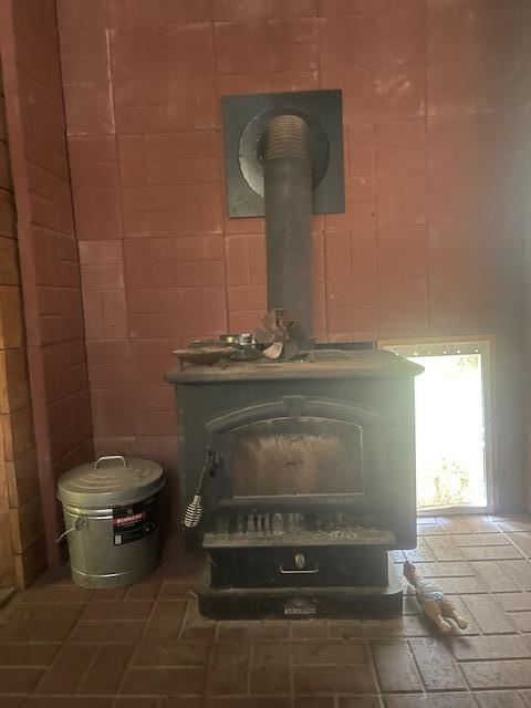 interior details featuring a wood stove