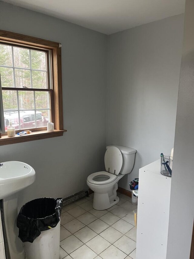 bathroom with tile patterned floors and toilet