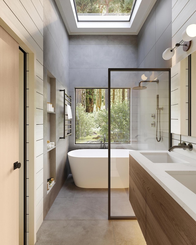 440 Belfast Rd Unit And1, Camden, ME 04843 - bathroom featuring a skylight, a tile shower, a sink, tile patterned flooring, and a freestanding tub
