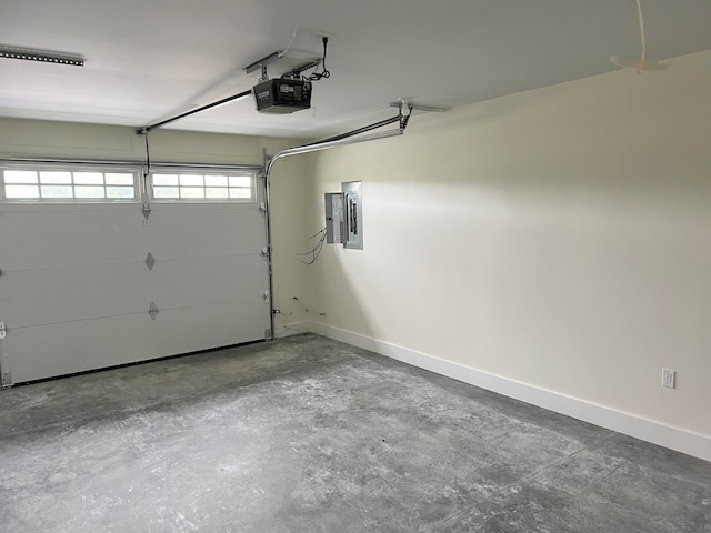 garage featuring electric panel and a garage door opener