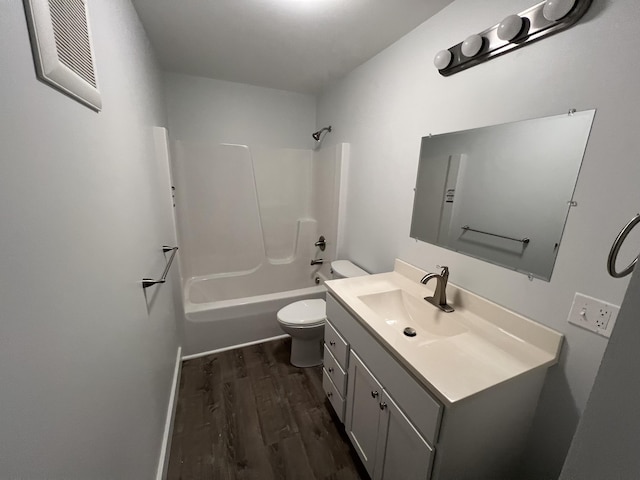 full bathroom featuring vanity, toilet, wood-type flooring, and shower / washtub combination