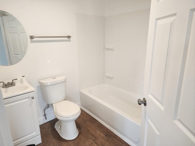 full bathroom featuring shower / bath combination, toilet, hardwood / wood-style floors, and vanity