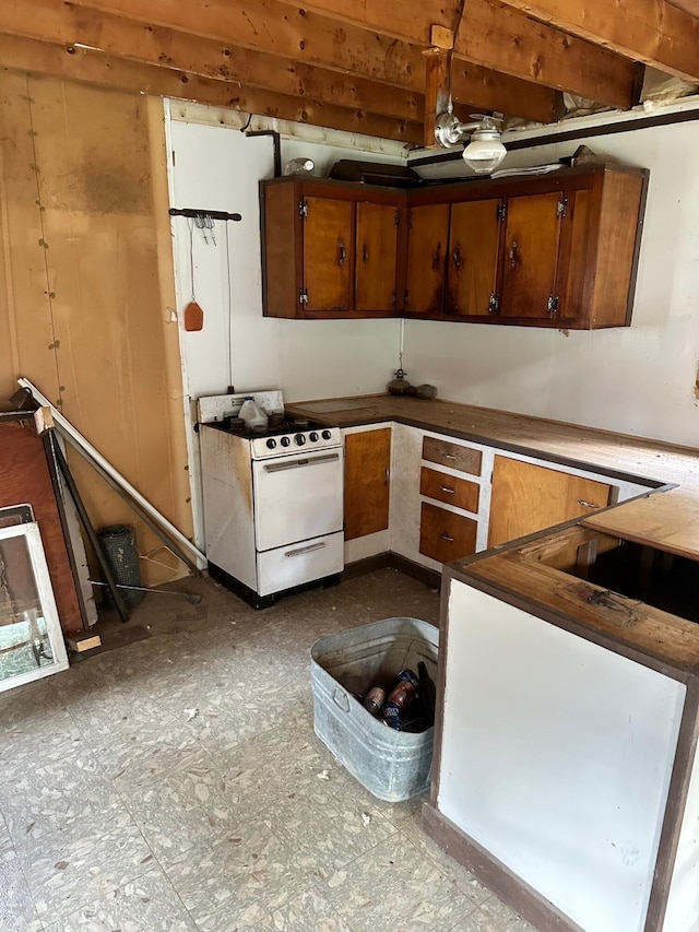 kitchen with white range with gas stovetop