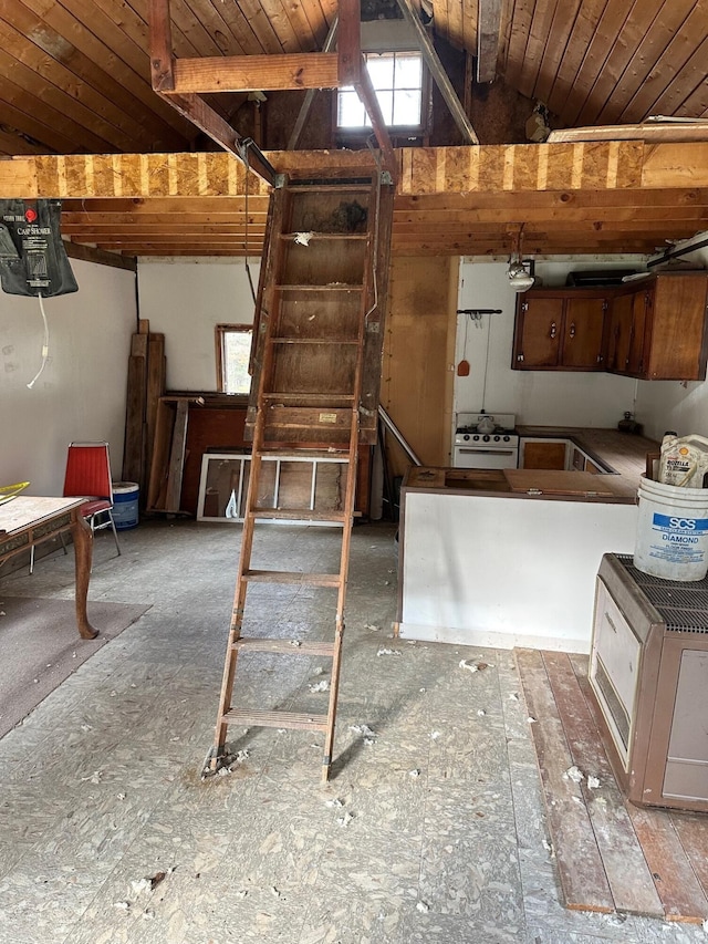 interior space with gas range, wood ceiling, and lofted ceiling