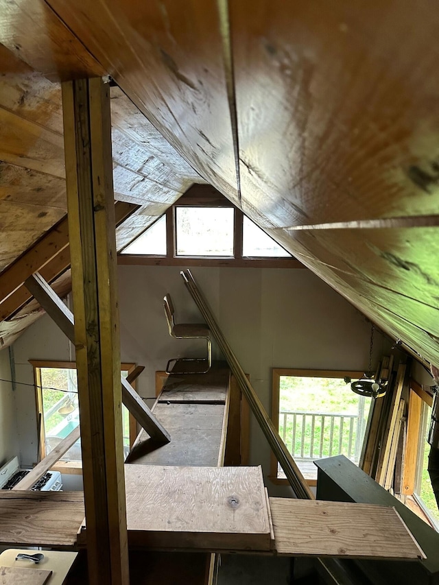 unfinished attic featuring plenty of natural light