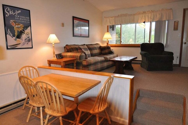 carpeted dining space featuring lofted ceiling and baseboard heating