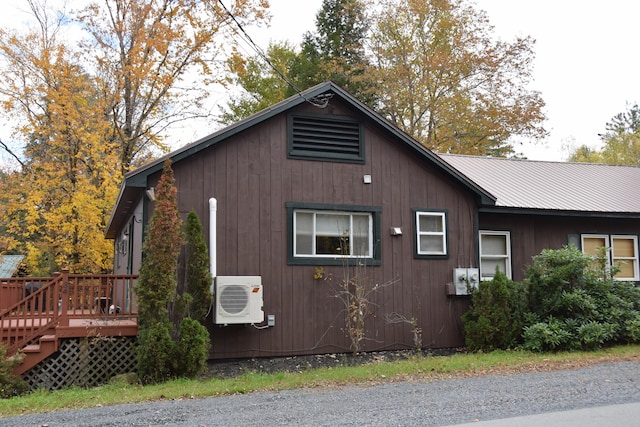 view of side of home featuring a deck