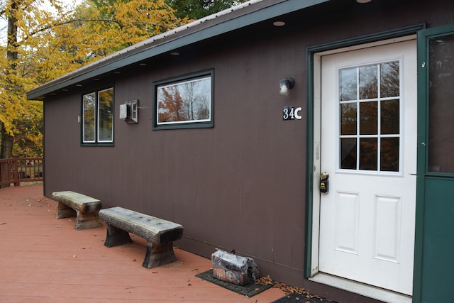 doorway to property featuring a wooden deck