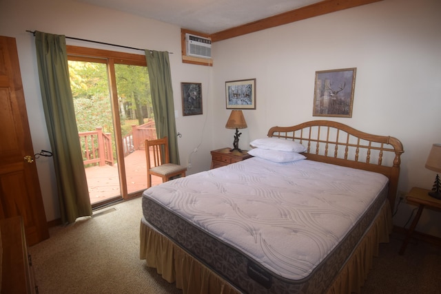 bedroom with an AC wall unit, access to exterior, and dark colored carpet