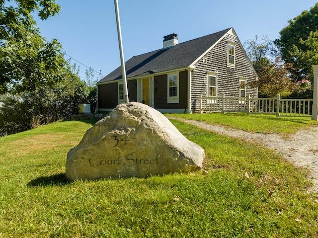 view of home's exterior featuring a lawn