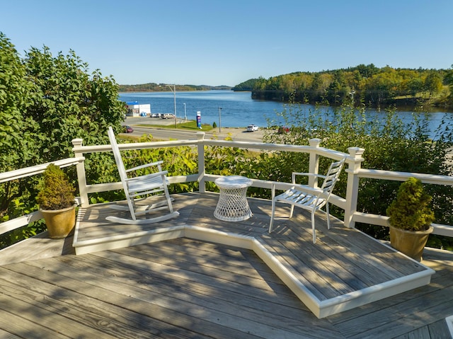 wooden terrace with a water view