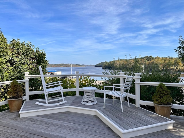 deck featuring a water view