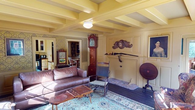 living room with hardwood / wood-style flooring and beam ceiling