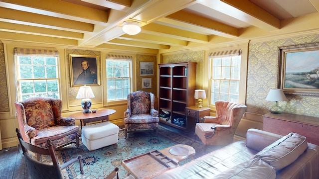 living area with hardwood / wood-style floors and beamed ceiling