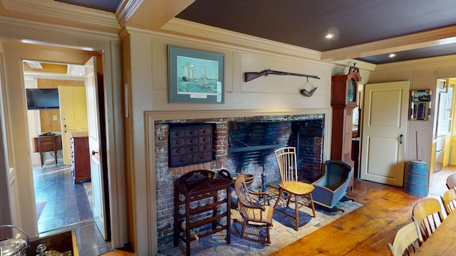 living room with ornamental molding and hardwood / wood-style flooring