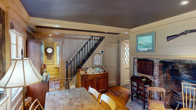 dining room featuring dark hardwood / wood-style flooring and crown molding