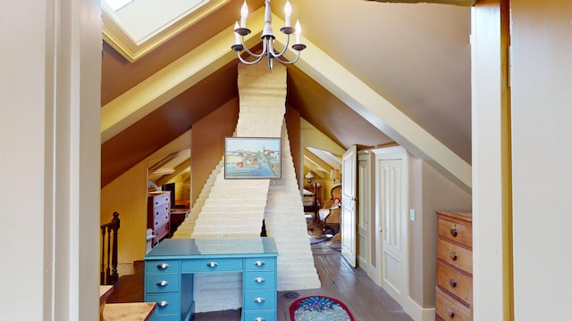 interior space featuring vaulted ceiling with skylight