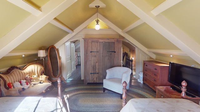 bedroom featuring lofted ceiling with beams