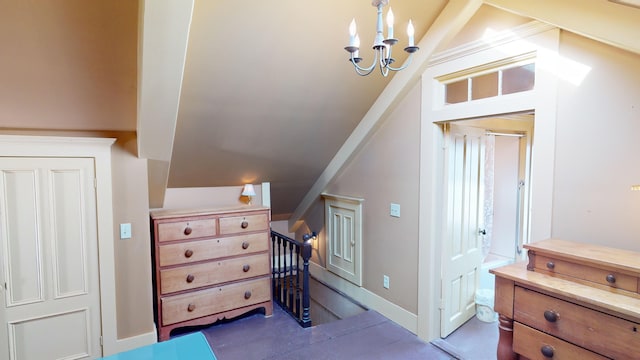 bonus room with a chandelier and lofted ceiling