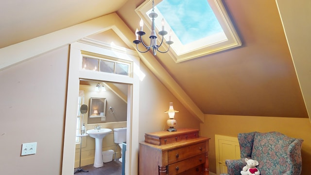 interior space with plenty of natural light, lofted ceiling with skylight, and sink