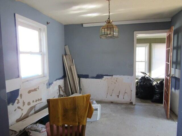 23 Dumas St, Lisbon, ME 04252 - sitting room with healthy amount of natural light and concrete floors