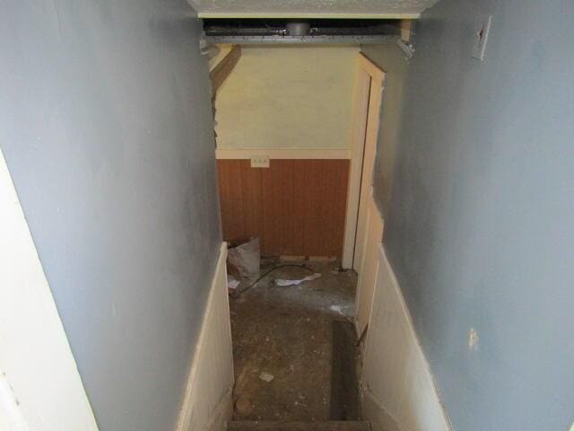 23 Dumas St, Lisbon, ME 04252 - stairway with wood walls and a wainscoted wall