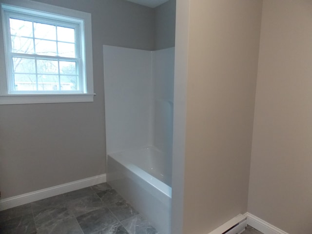 bathroom featuring shower / washtub combination and tile flooring