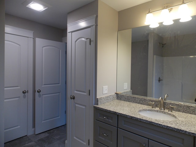 bathroom featuring tile floors and vanity